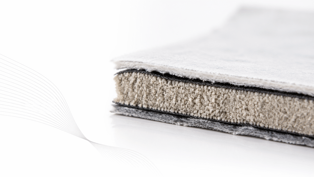 Geosynthetic clay liner roll showing bentonite core between geotextile layers