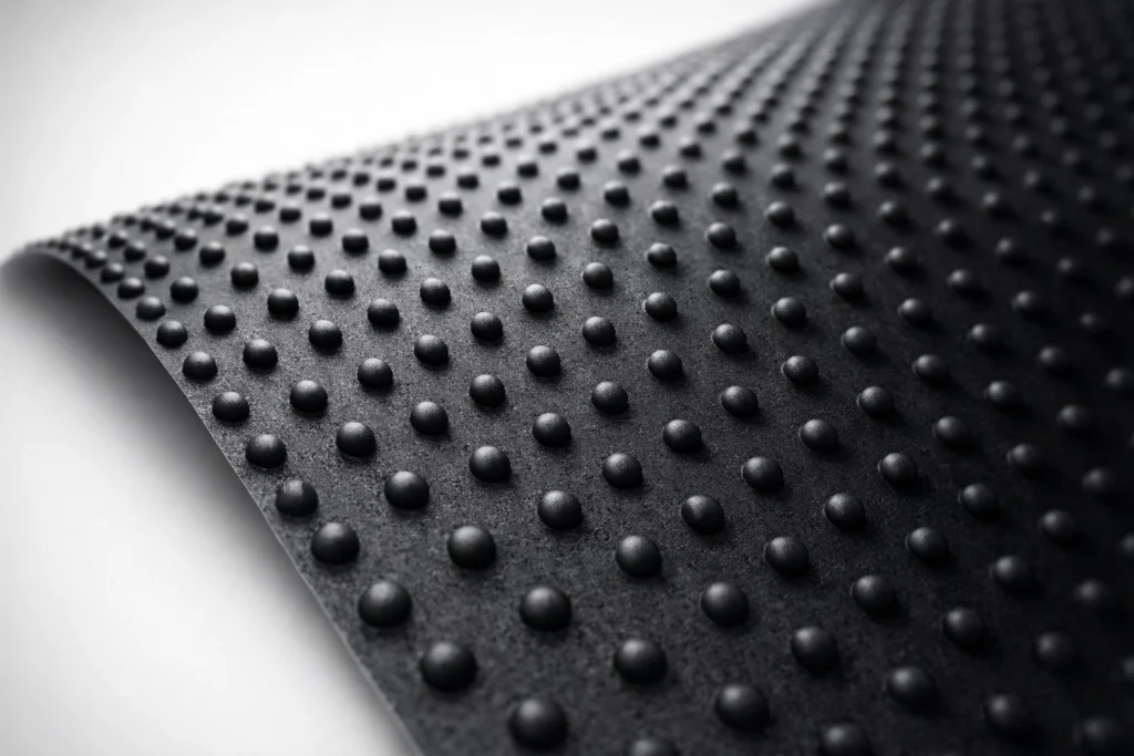 Textured HDPE geomembrane sheet with raised studs