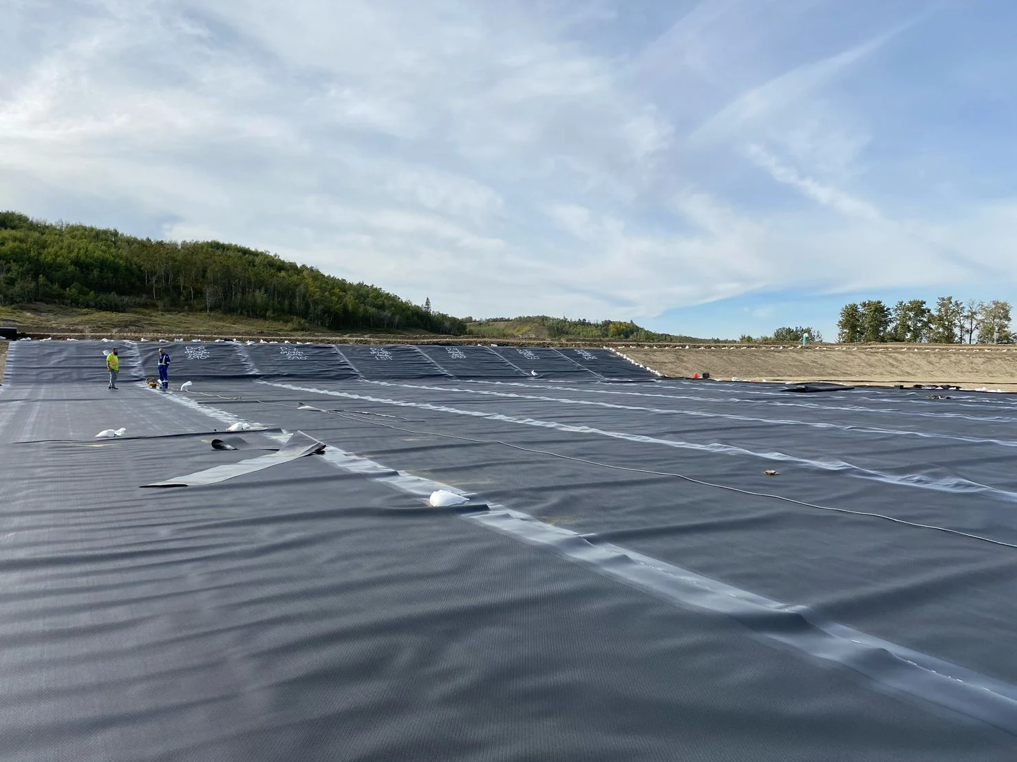Geomembrane-lined containment basin