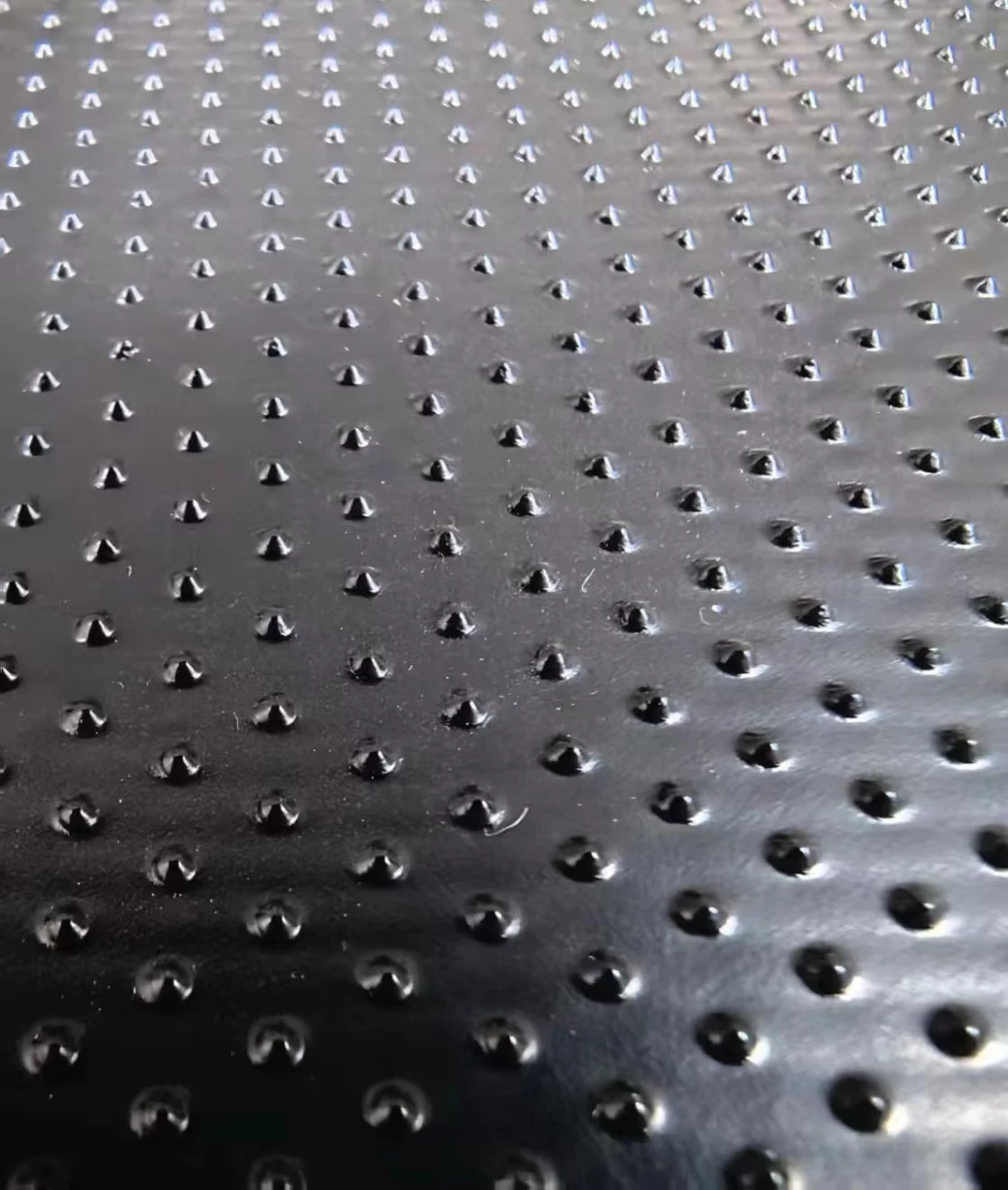 Textured HDPE geomembrane surface detail