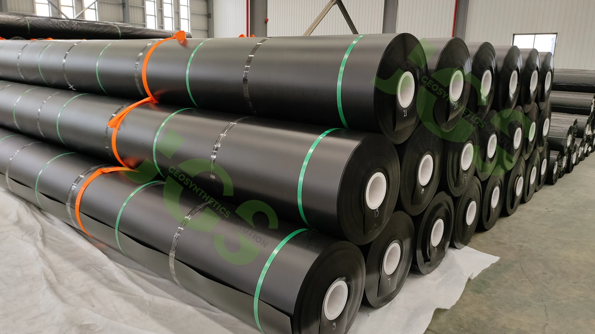 Jinseed smooth HDPE geomembrane rolls in factory storage