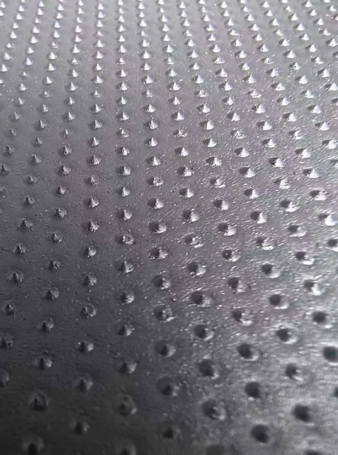 Double-sided textured geomembrane surface detail